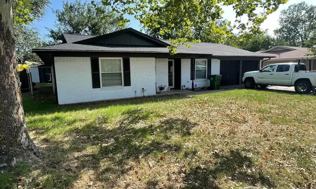 Professional roofing crew working on a residential roof in Clear Lake
